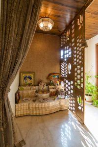 Home temple design with etchings on room divider - Beautiful Hom