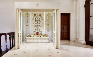 Unique Temple design in the corner of the room with glass doors